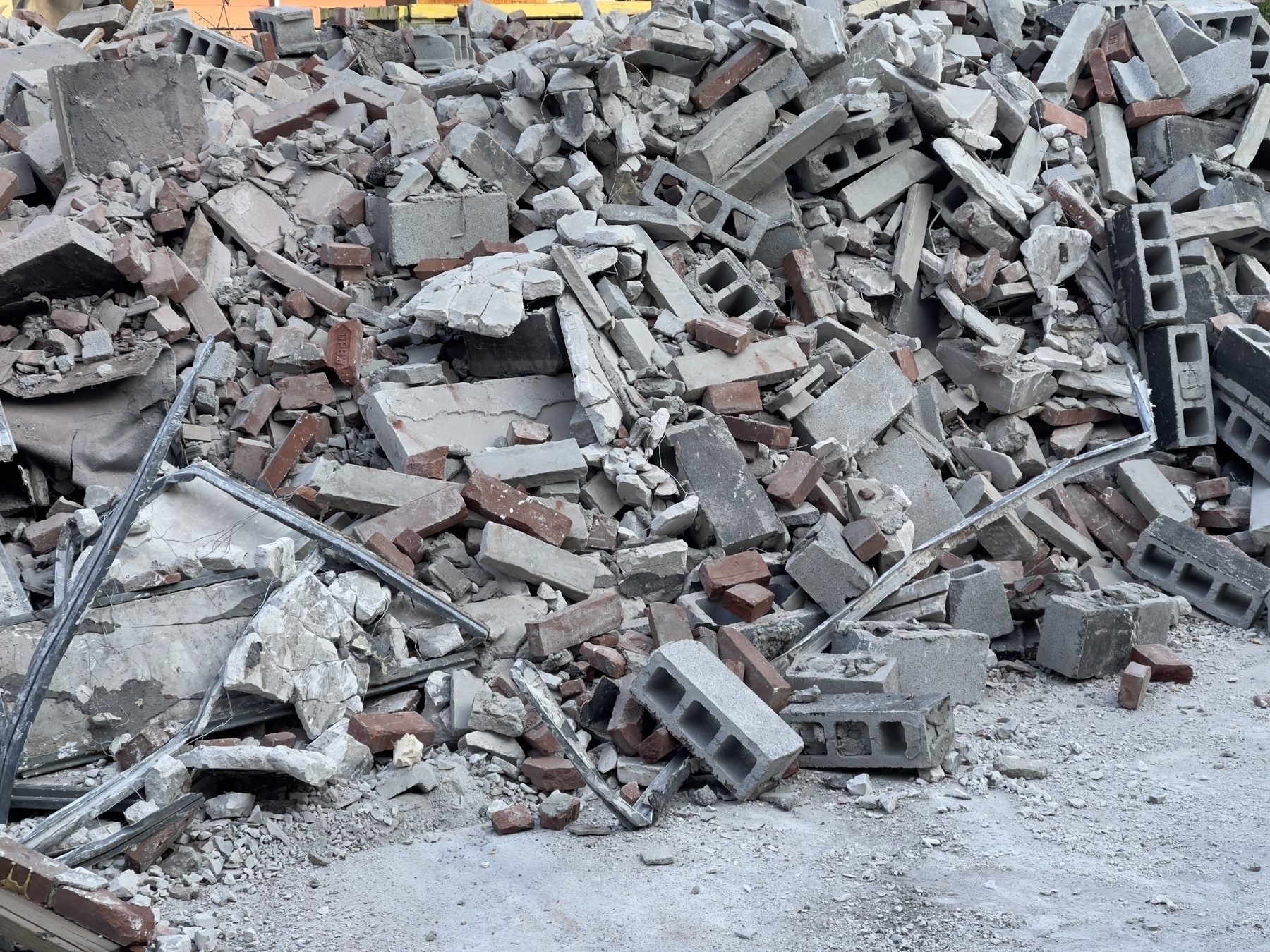 Demolition debris pile, mostly concrete blocks.
