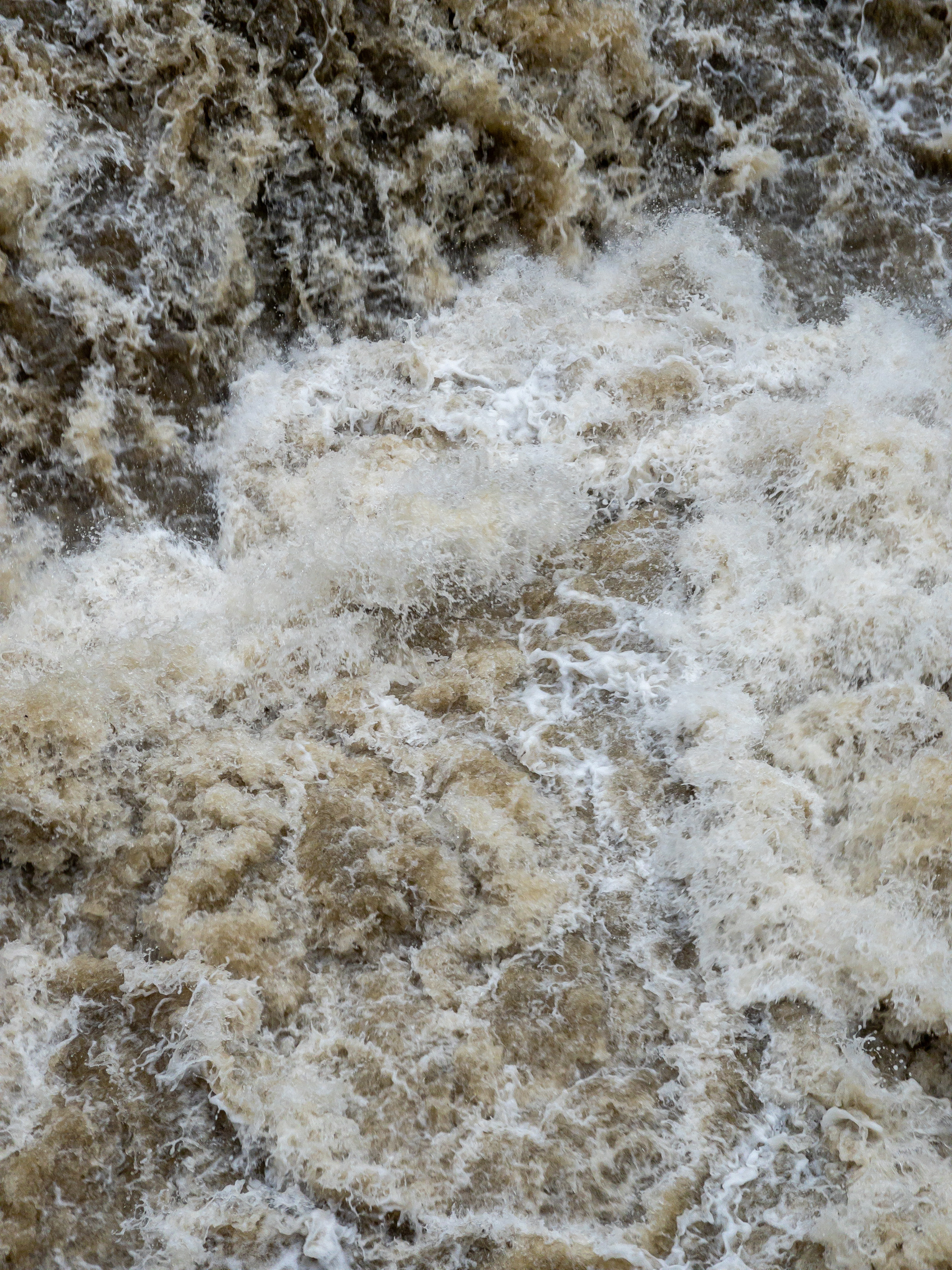 Closeup of churning rapids after heavy rainfall.
